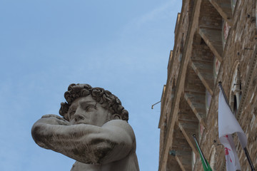 Detailed view of the copy of statue David by Michelangelo in front of the Palazzo Vecchio,...
