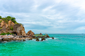 Fototapeta premium Scenery of natural with clear sea water, beautiful rock and white sand around Ko kham underwater park in Sattahip,Pattaya,Chonburi,Thailand. Tourists attractions in Pattaya.