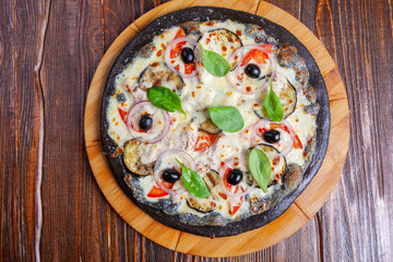 Pizza with cuttlefish ink and eggplant