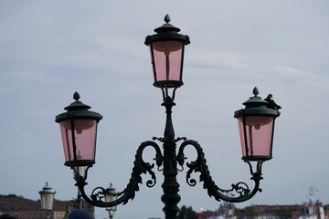 Fototapeta na wymiar old street lamp with three arms