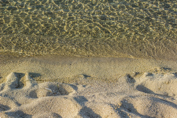 local sand shore line natural background and transparent water 