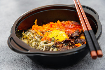 Bibimbap Rice, vegetables, minced marinated beef, spicy sauce and egg yolk