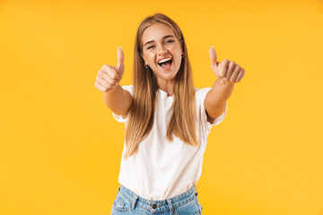 Cheerful young girl wearing casual clothing standing