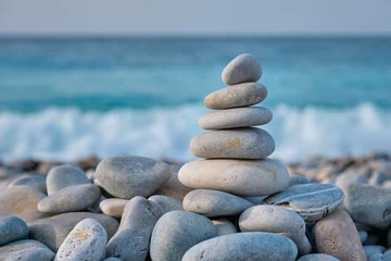 Fotobehang Rustgevend Zen balanced stones stack on beach  © Dmitry Rukhlenko