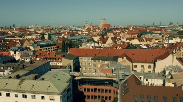 Low altitude aerial shot of Munich. Flight towards historic center. Germany