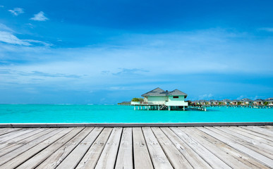tropical Maldives island with white sandy beach and sea