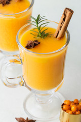 Glasses with hot hippophae tea on white