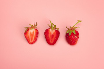 Strawberries on pink background. Fresh organic food concept