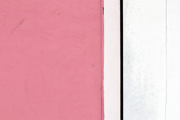 pink and white concrete wall in the city.