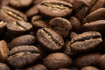 Coffee beans close-up background. Fresh roasted