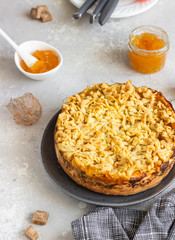 Cheesecake or casserole with cottage cheese, orange jam and crumble. Healthy dessert.