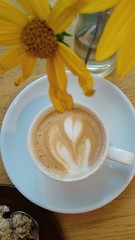  cup of cofee and yellow flower