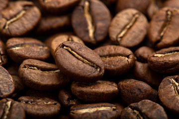 Coffee beans close-up background. Fresh roasted