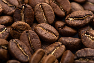 Coffee beans close-up background. Fresh roasted