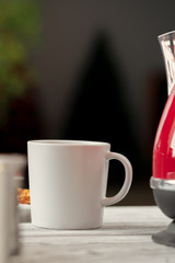 White porcelain cup on kitchen counter close up