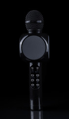 black modern karaoke microphone on black background