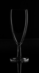 silhouette of an empty wine glass on a black background