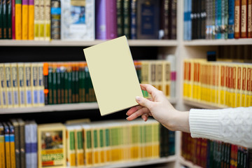 collection of various white paper on white background. a book under the library