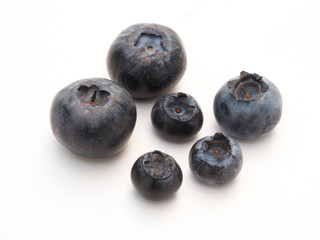 Fresh organic blueberries closeup on white