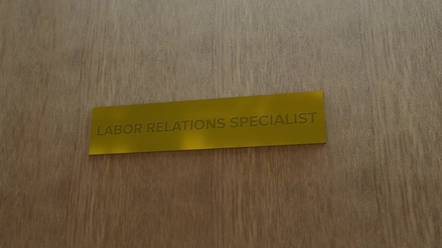 golden door sign Labor relations specialist. enter to room
