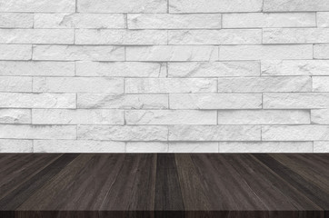 white brick wall and wooden floor
