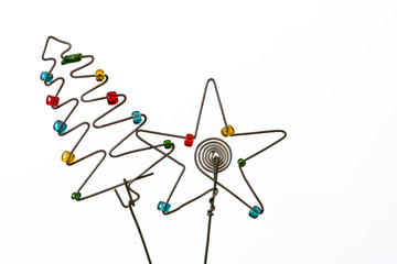 An iconic but simple Christmas tree and  star created out of wire and beads.
