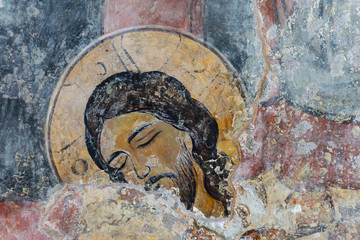Ancient fresco of Jesus Christ on the wall in a Christian temple. Orthodox Christianity