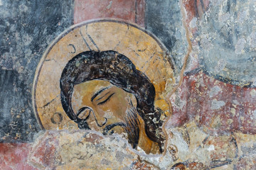 Ancient fresco of Jesus Christ on the wall in a Christian temple. Orthodox Christianity