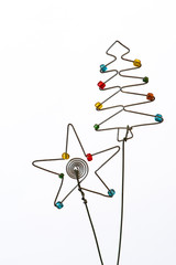 An iconic but simple Christmas tree and  star created out of wire and beads.