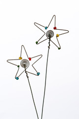 Two iconic but simple Christmas stars created out of wire and beads.