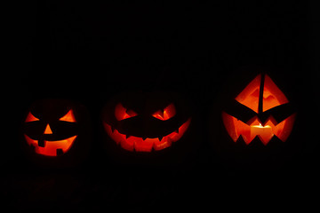 Halloween - old jack-o-lantern on black background
