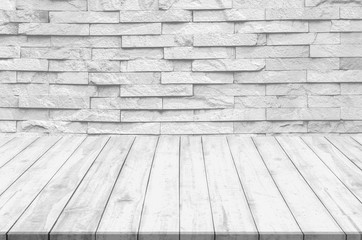 white brick wall and wooden floor