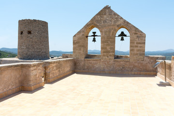 Fototapeta na wymiar bell tower in the medieval castle of Capdepera in Majorca