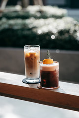 glass of coffee on wooden table