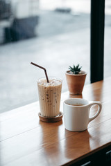 cup of coffee on wooden table in cafe