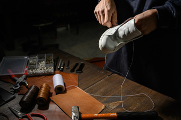 Men's shoes made of leather leather, the shoemaker workshop. shoemaker performs shoes