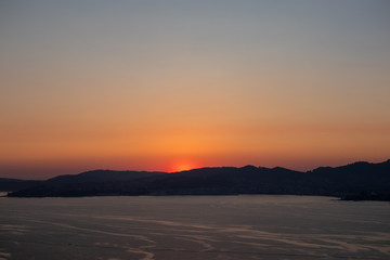 Fototapeta na wymiar Sunset at the mouth of the Vigo River. July - 2019, Vigo, Galicia, Spain.