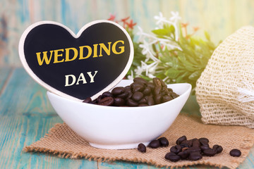 Word wedding day on heart tag with wood background,wedding concept.