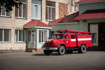 Fototapeta na wymiar Fire transport truck old USSR on fire station Ukraine