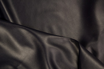 Black eco-leather close-up. Skin texture