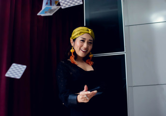 Portrait of a gypsy woman throwing cards