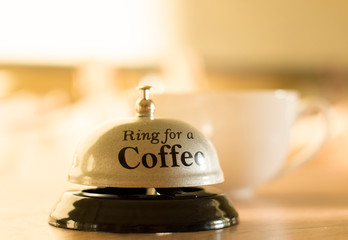 A cup of coffee. Wake up morning and deadline. Wake up. Steaming coffee cup on a background of sunbeams, coffee good time. Good morning coffee. Background with copy space for text.