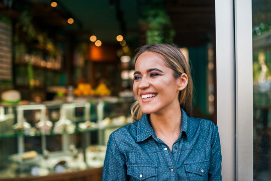Close-up portrait of a happy small business owner.