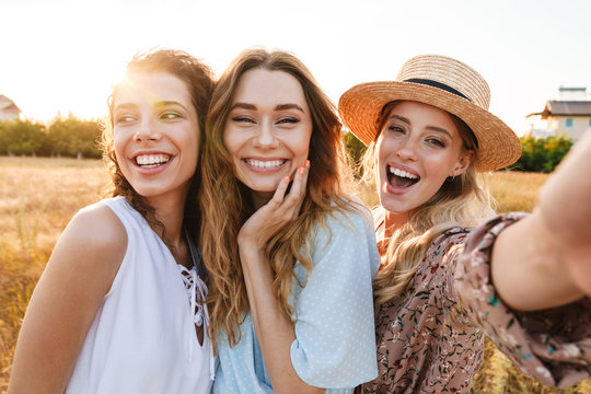 Photo of happy caucasian women taking selfie photo and laughing