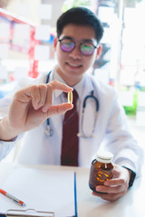 Fish Oil Omega 3 in the doctor's hand.