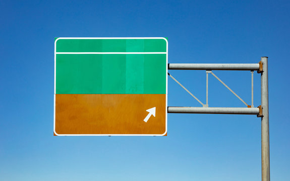 Naklejki Blank road sign on the highway, clear blue sky background. USA.
