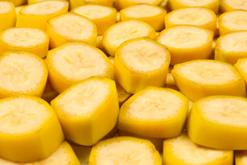 Fresh banana slices background. Top view.