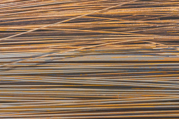 Background texture of old rusty steel bars construction materials in a construction site
