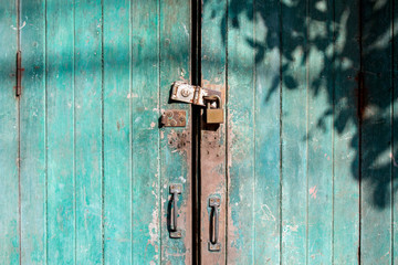 Doors is locked with a padlock.