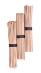 Soba noodles, isolated on white background. Bundle of buckwheat japanese soba noodle sticks. Asian food. Top view.